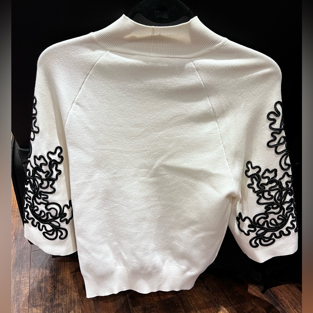 Anne Fontaine White Turtleneck Sweater with Black Embroidered Sleeves